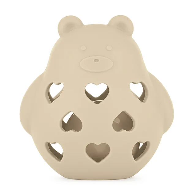 PETITE&MARS Hračka silikonová s chrastítkem bear basil desert sand 0m+